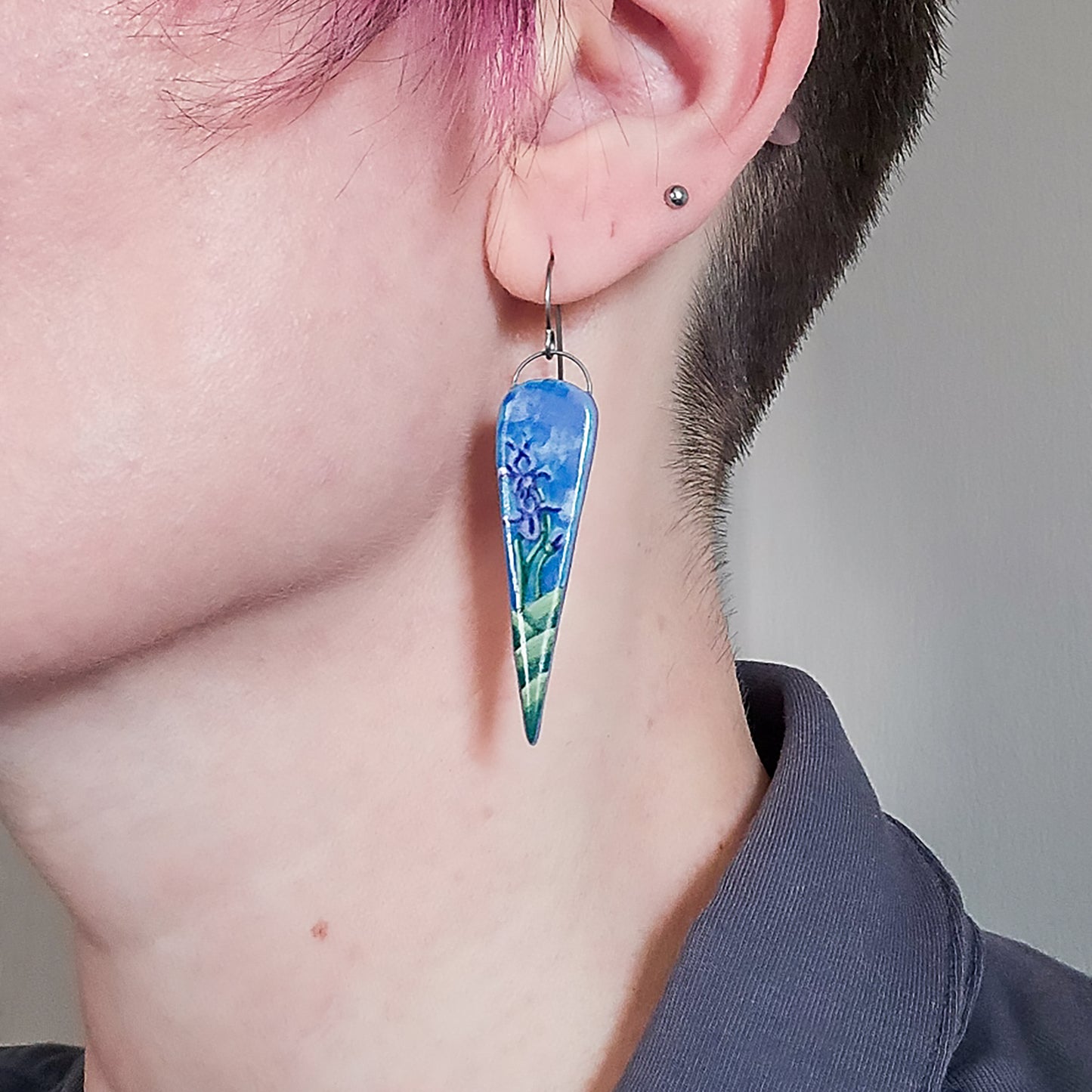 Purple Iris Point earring on model.
