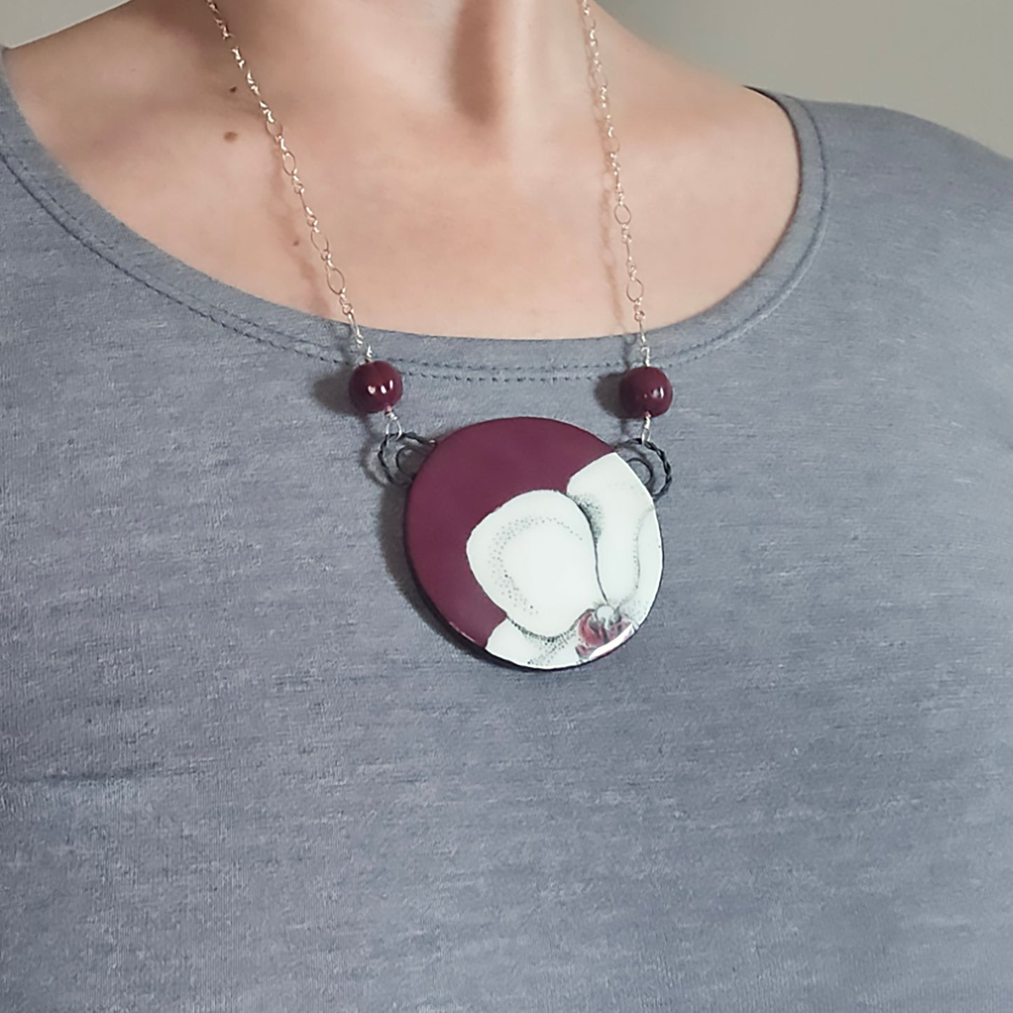 Round Orchid Necklace in Burgundy on model.
