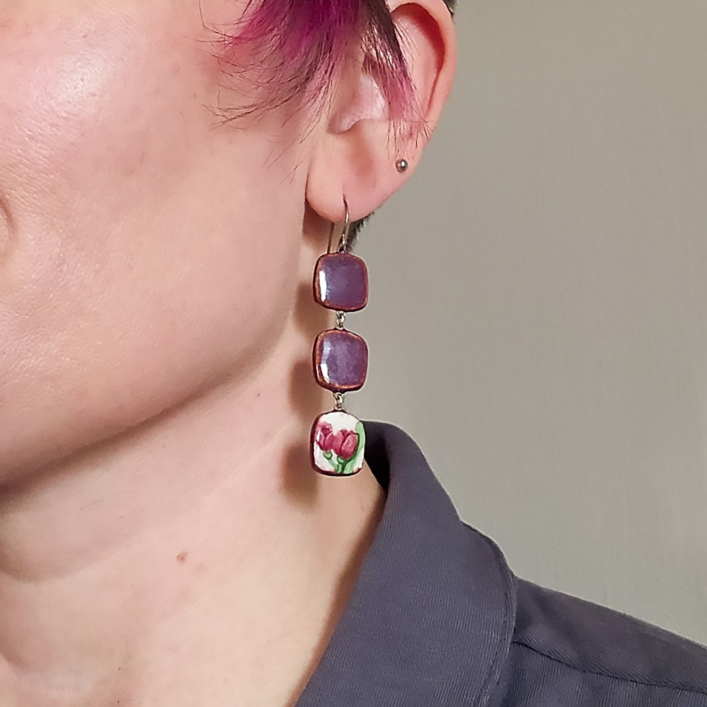 Trilevel Asymmetrical Tulip Earring in Pink on model.