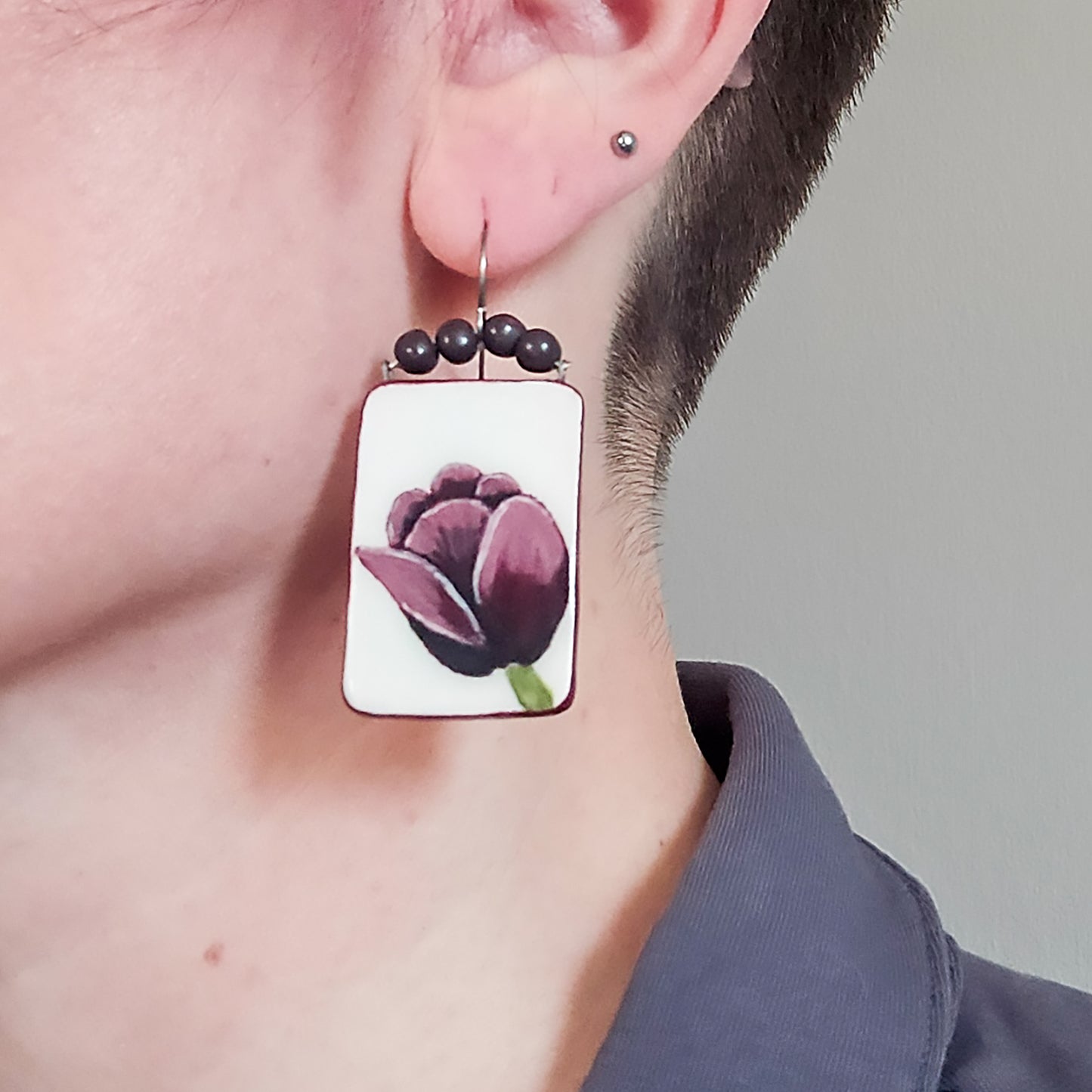 Tulip Panel Dangle Earrings in Burgundy on model.