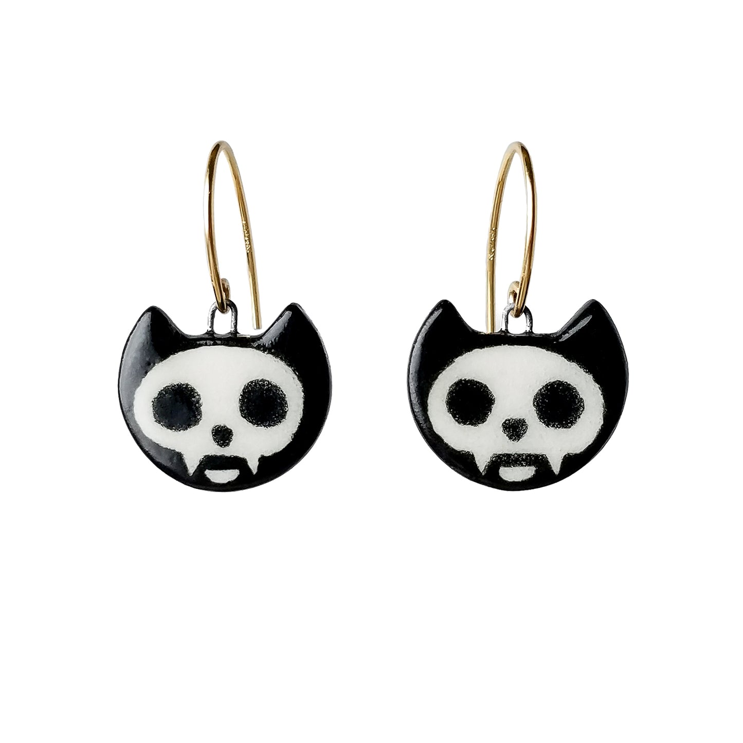 Porcelain cat heads painted as Skelecat cat skulls on gold-filled curved ear wires.  Earrings are on a white background.